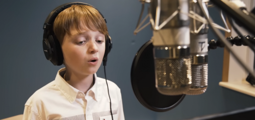 Cormac Thompson performing "Empty Chairs at Empty Tables" during a studio recording.